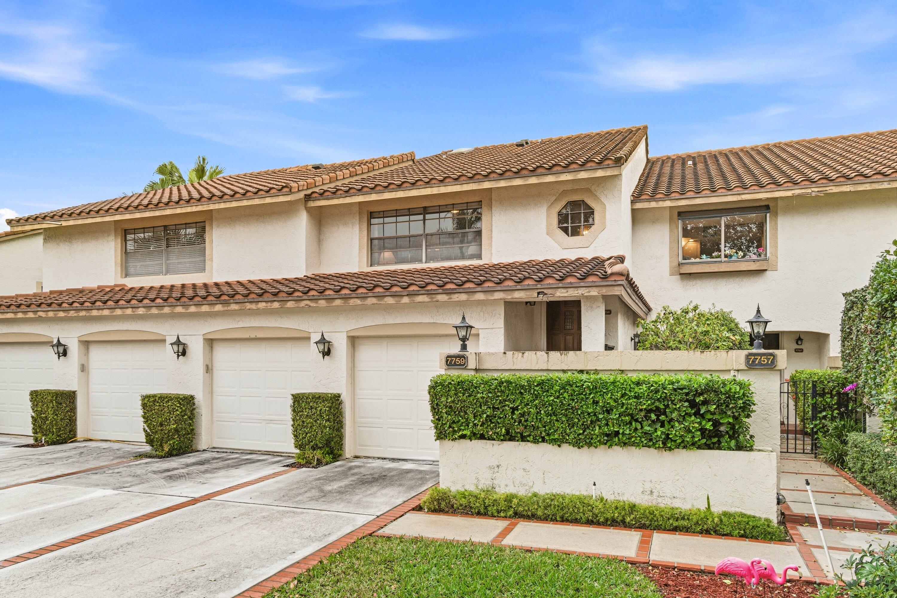7759 La Mirada Drive Boca Raton, FL 33433 - Photo 3 of 37 front view of a house with a yard