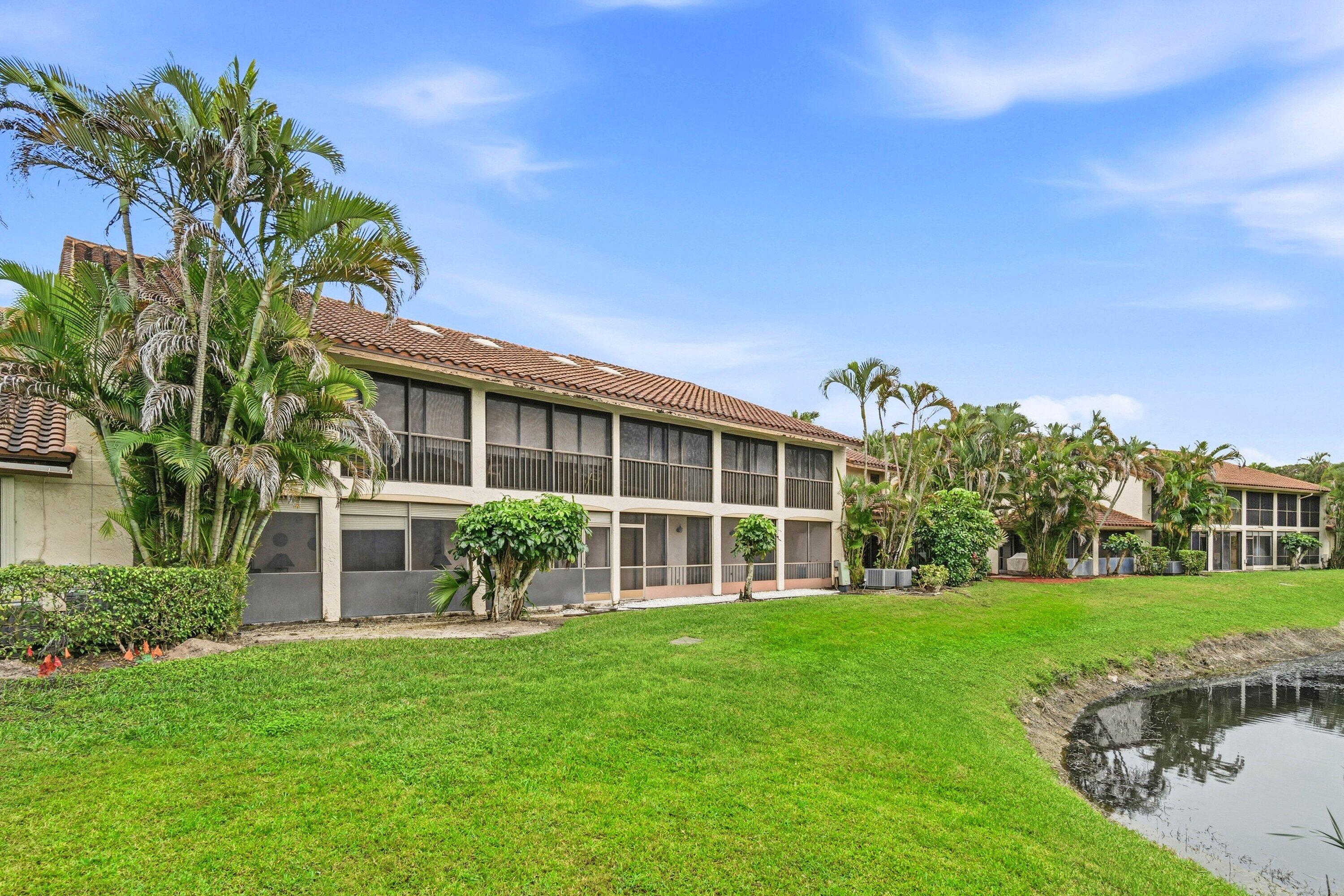 7759 La Mirada Drive Boca Raton, FL 33433 - Photo 32 of 37 a house view with a garden space