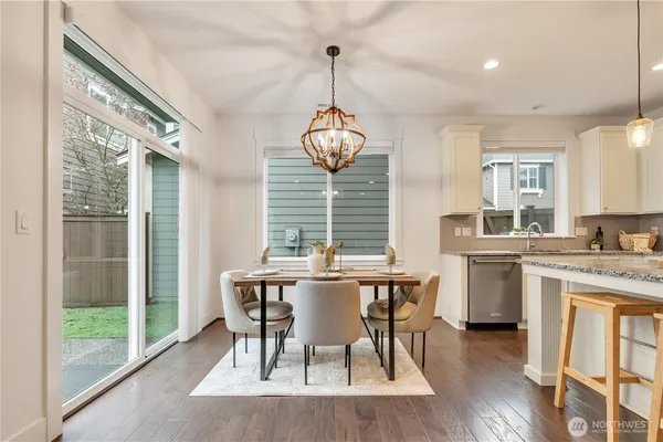 a view of a dining room with furniture window and outside view