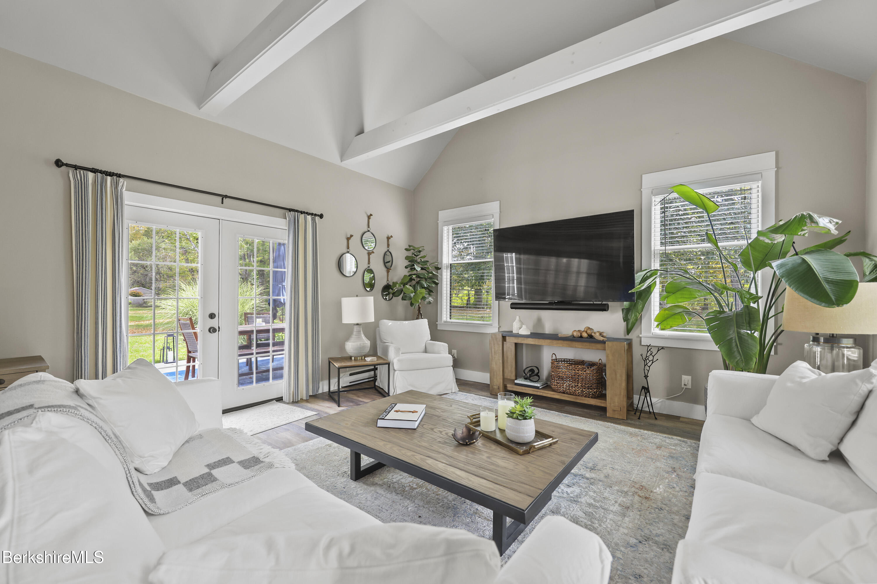 17 Iron Mine Road West Stockbridge, MA 01266 - Photo 11 of 49 a living room with furniture a flat screen tv and a large window