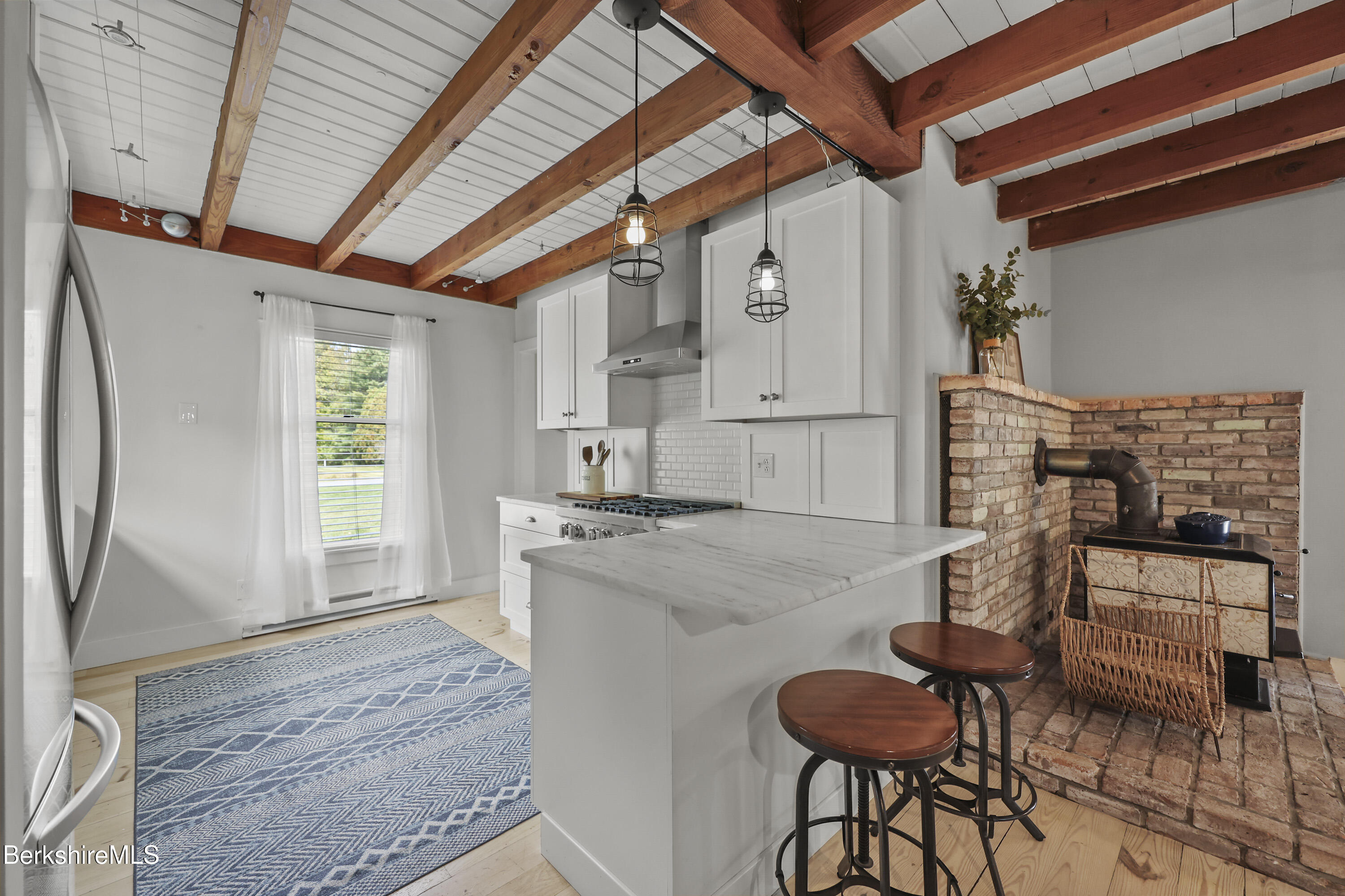 17 Iron Mine Road West Stockbridge, MA 01266 - Photo 16 of 49 a kitchen with furniture and a fireplace