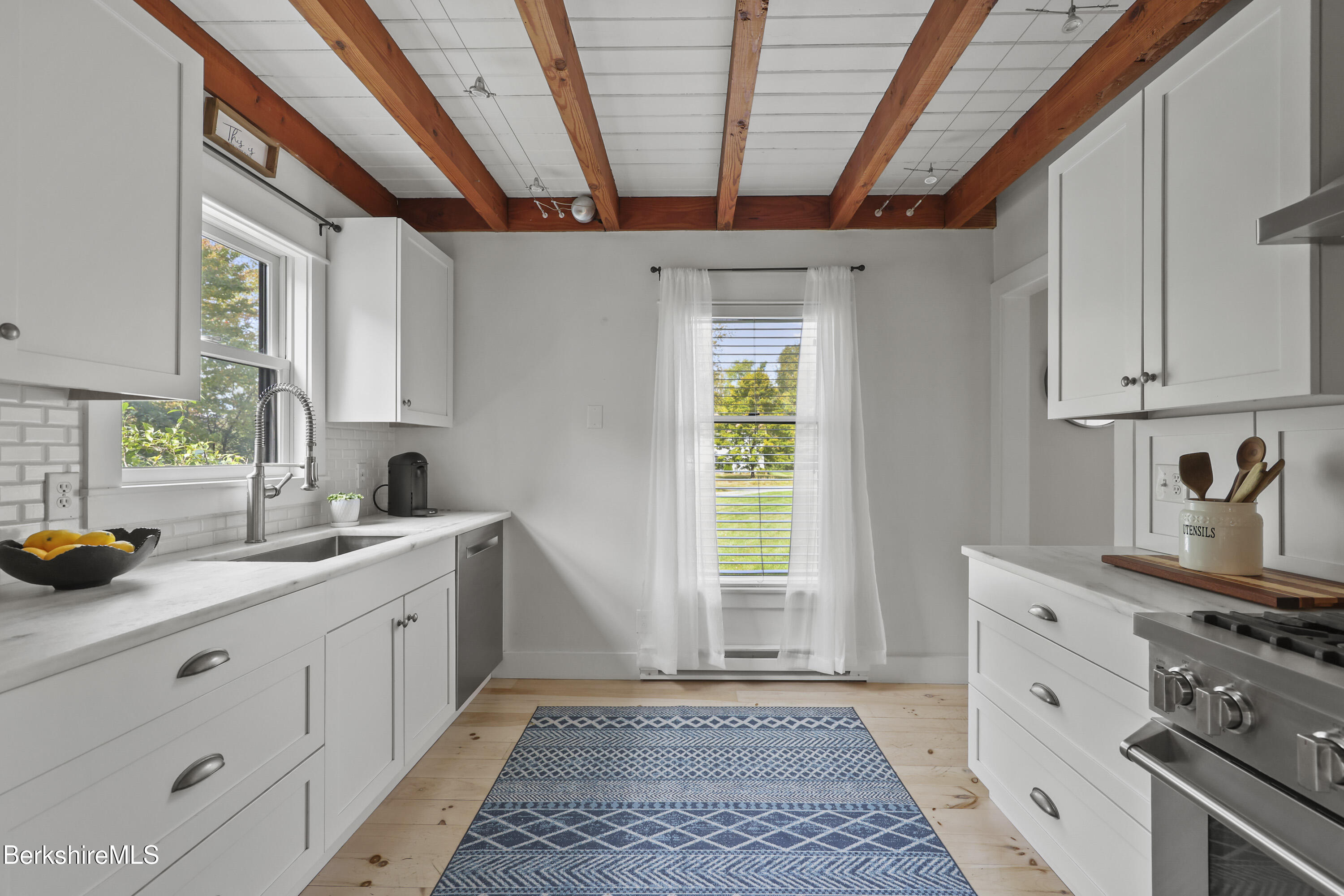 17 Iron Mine Road West Stockbridge, MA 01266 - Photo 17 of 49 a kitchen with a sink a stove cabinets and a window