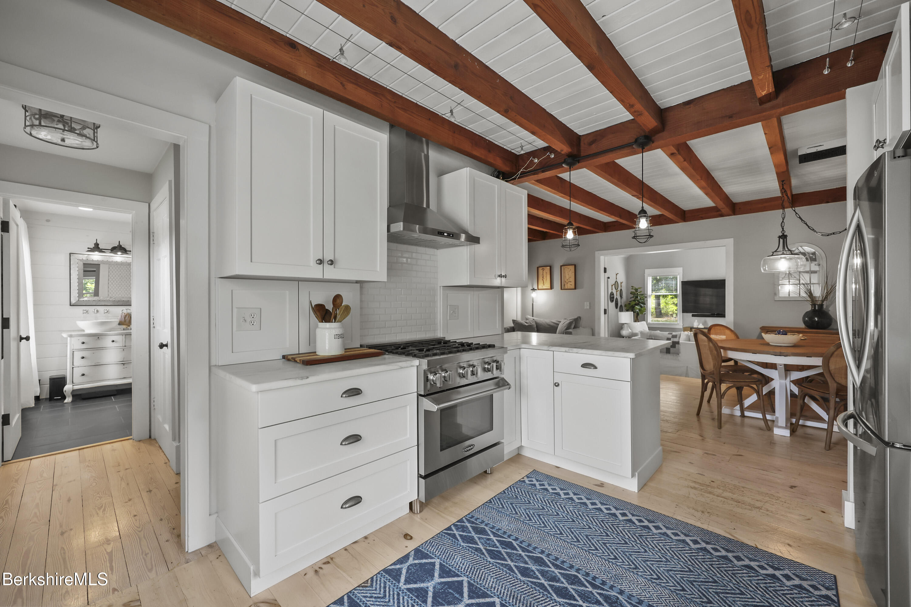 17 Iron Mine Road West Stockbridge, MA 01266 - Photo 19 of 49 a kitchen with white cabinets and white appliances
