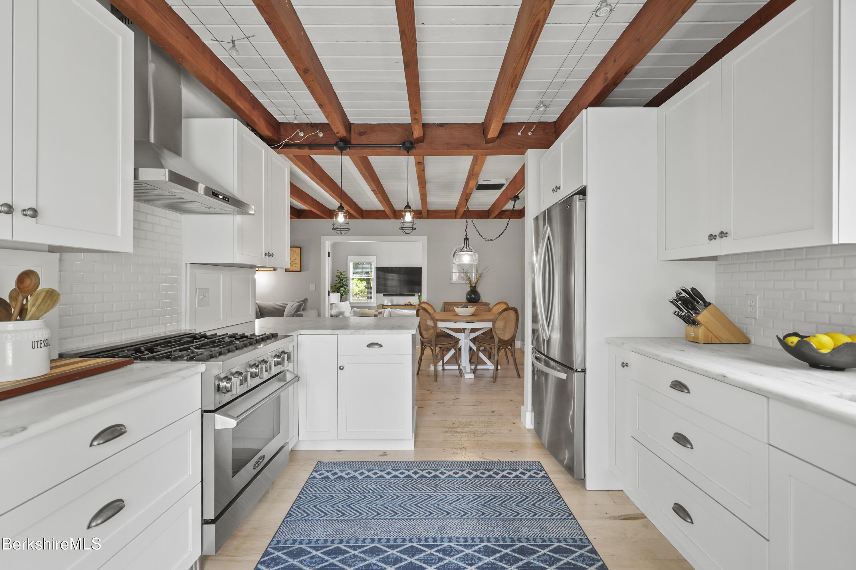 17 Iron Mine Road West Stockbridge, MA 01266 - Photo 22 of 49 a kitchen with white cabinets and white appliances