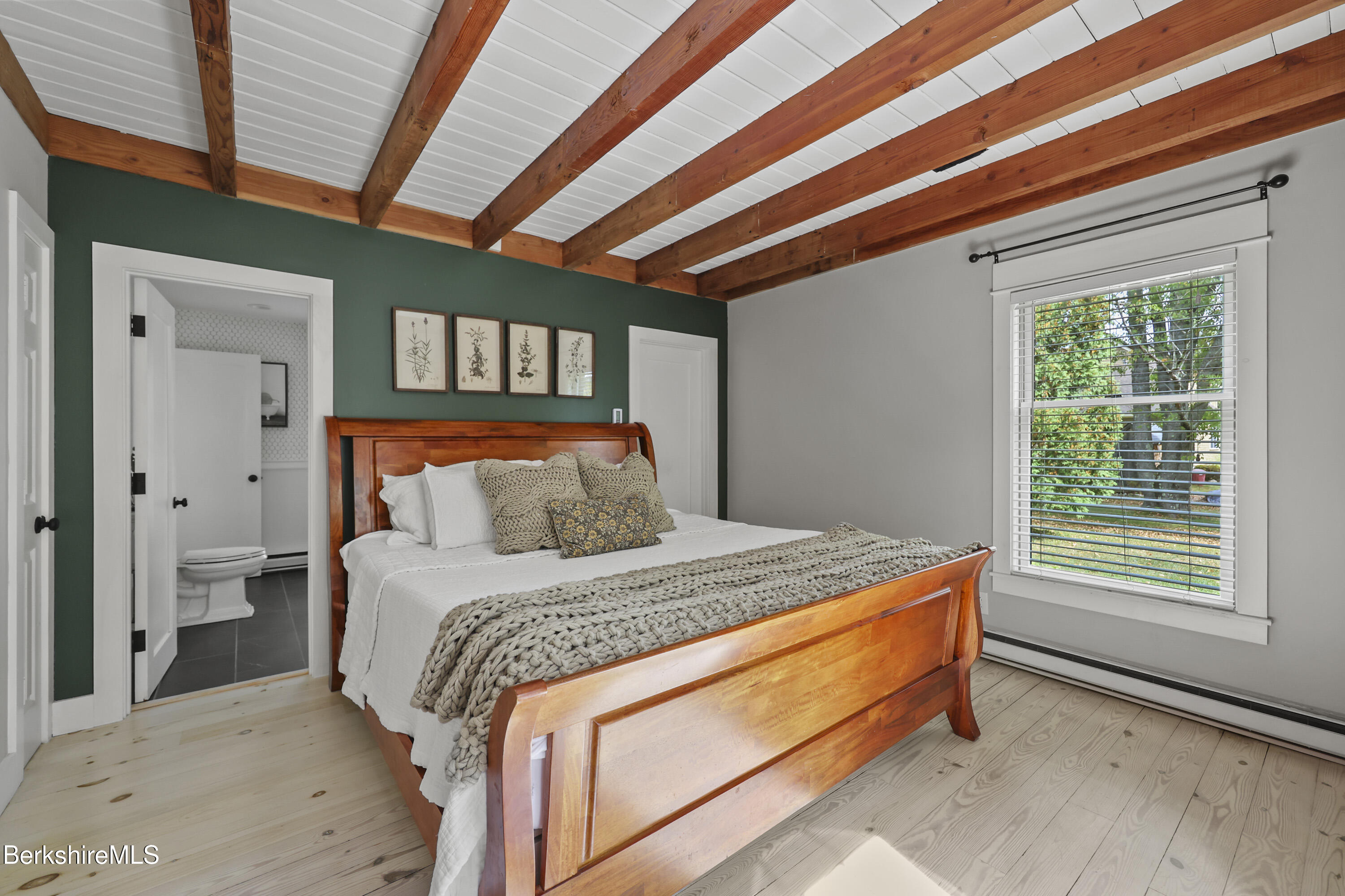17 Iron Mine Road West Stockbridge, MA 01266 - Photo 25 of 49 a bed sitting in a bedroom next to a window