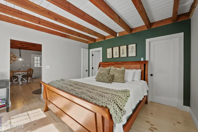 a bedroom with a bed and a table