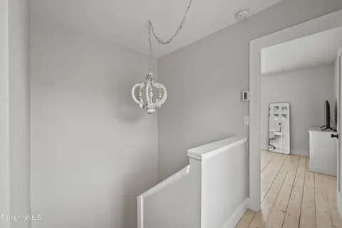 a view of a storage & utility room with wooden floor
