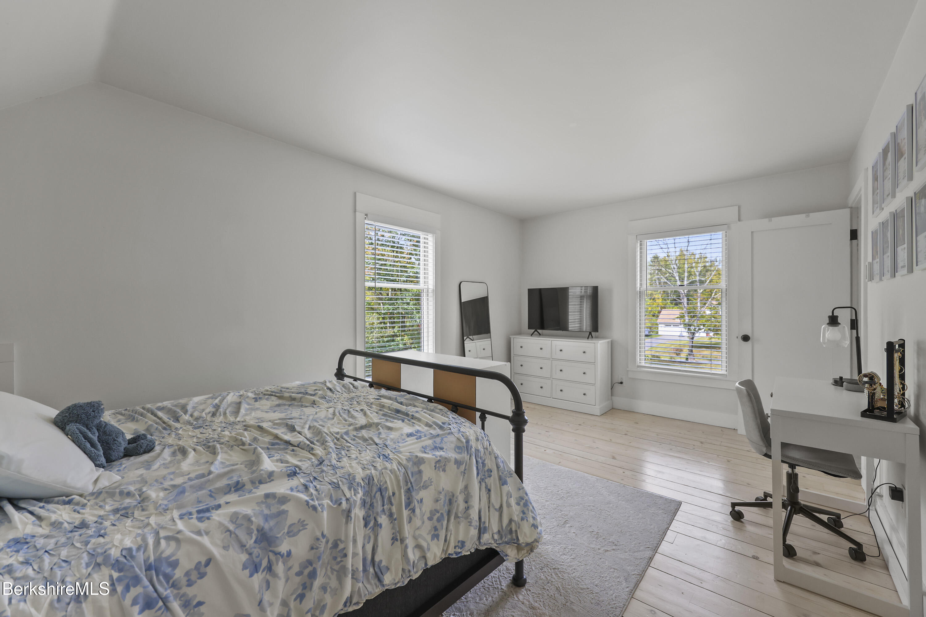 17 Iron Mine Road West Stockbridge, MA 01266 - Photo 32 of 49 a bedroom with a bed a chair and a large window