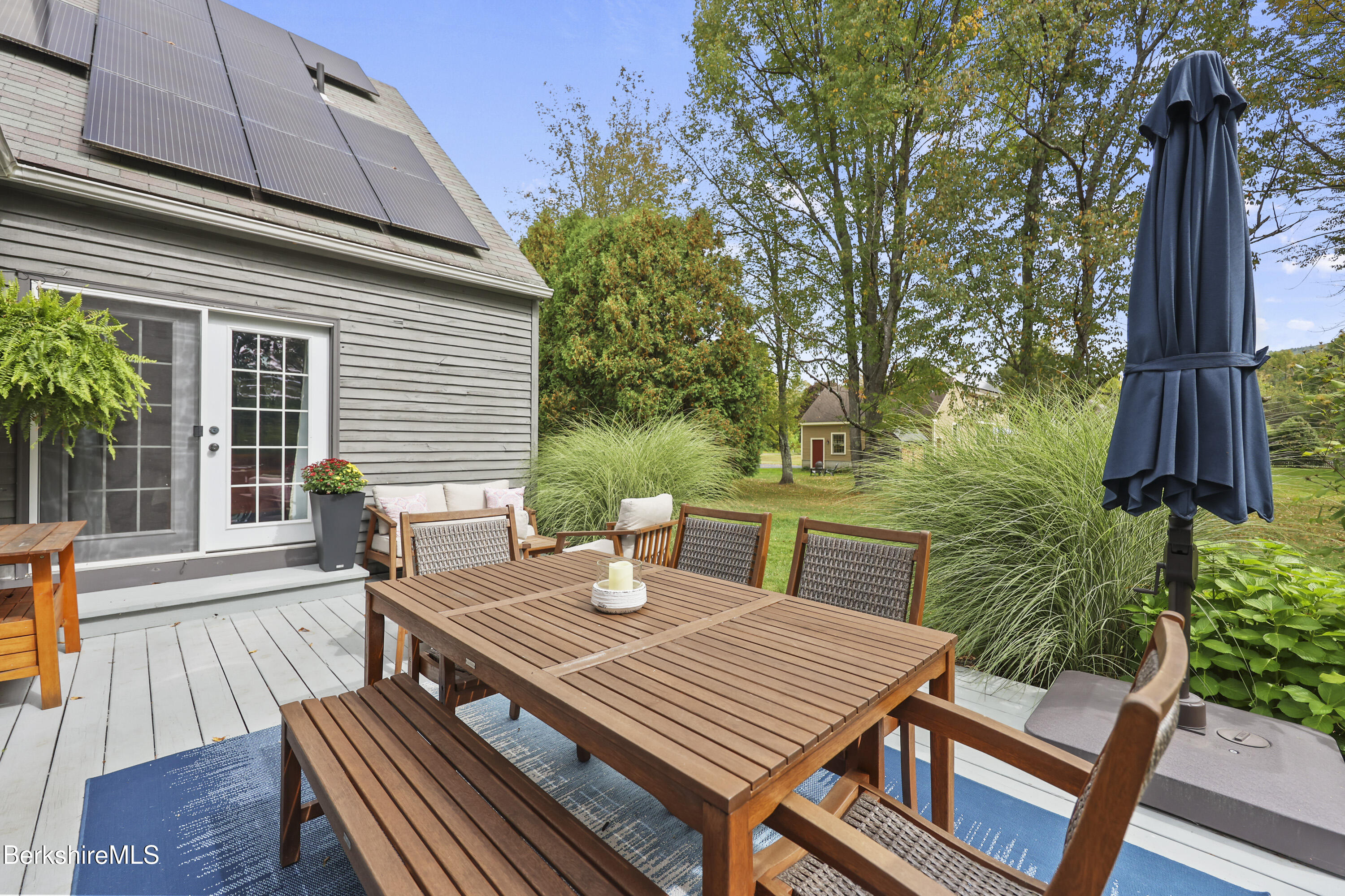 17 Iron Mine Road West Stockbridge, MA 01266 - Photo 41 of 49 a view of a patio with table and chairs with wooden floor and fence