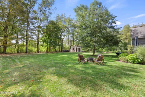 a view of a park with large trees