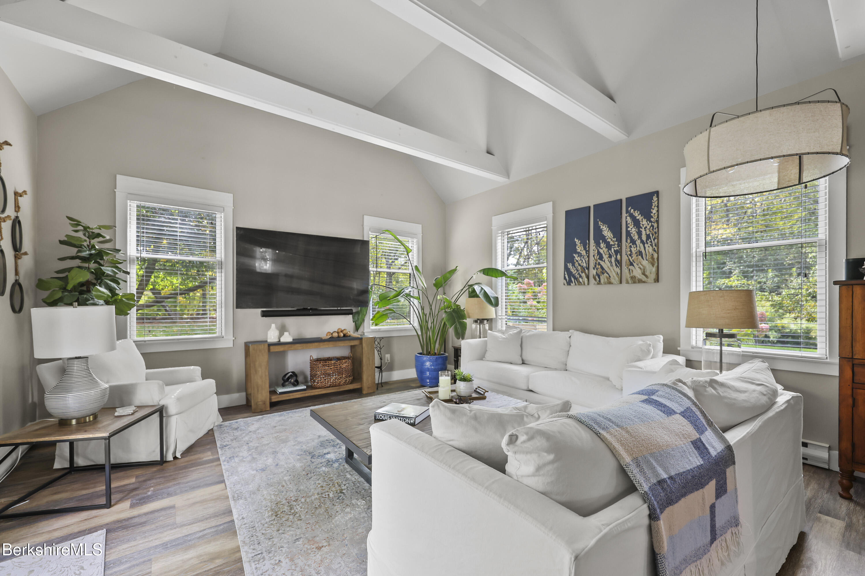 17 Iron Mine Road West Stockbridge, MA 01266 - Photo 10 of 49 a living room with furniture a flat screen tv and a large window