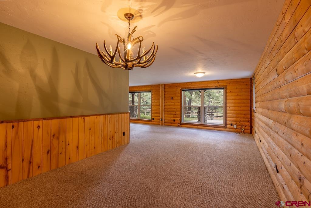 30 Stage Coach Road Bayfield, CO 81122 - Photo 17 of 36 a view of a room with window and chandelier