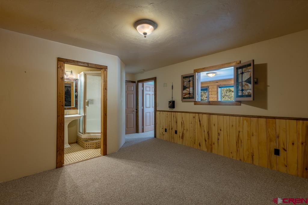 30 Stage Coach Road Bayfield, CO 81122 - Photo 19 of 36 a view of a hallway and a livingroom with furniture