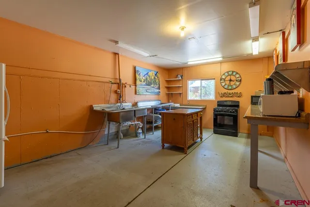 a view of a kitchen with furniture and a window