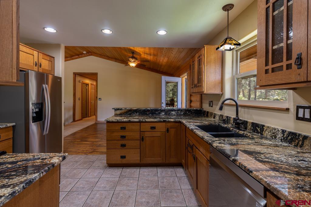 30 Stage Coach Road Bayfield, CO 81122 - Photo 5 of 36 a kitchen with stainless steel appliances granite countertop a sink stove and refrigerator
