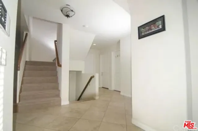a view of a hallway with staircase