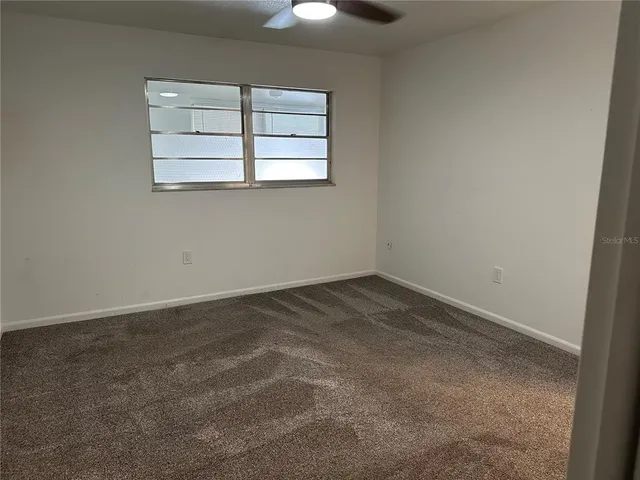 a bathroom with a sink toilet vanity and shower