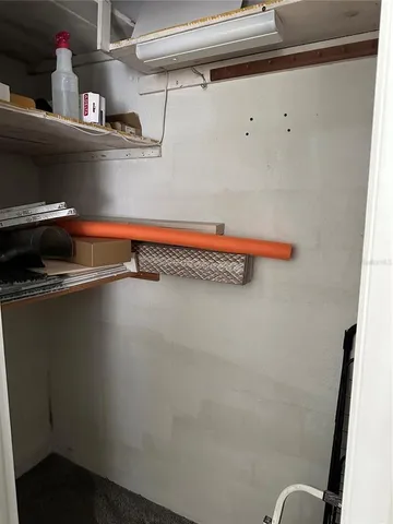 a view of a livingroom with furniture and a flat screen tv