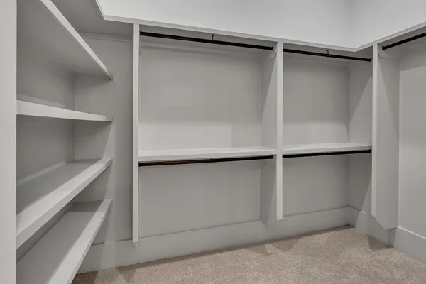 a view of an empty walk in closet