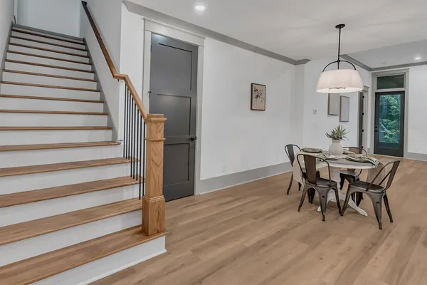 a view of a dining room with furniture window and wooden floor