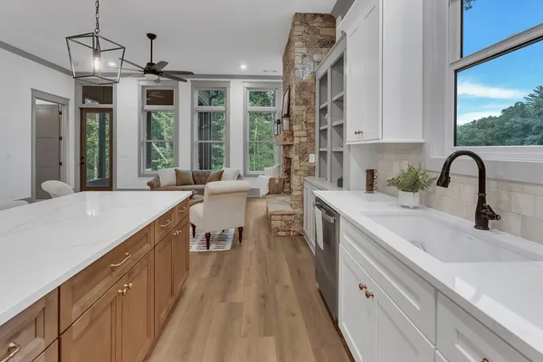 a kitchen with a sink stove and cabinets