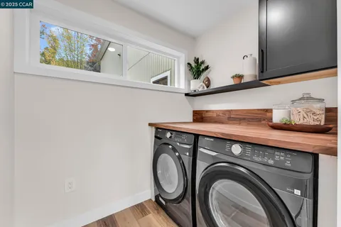 a view of storage and utility room with washer and dryer