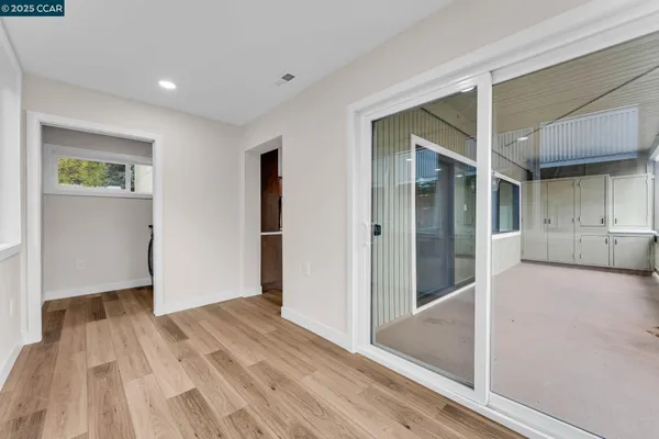 a view of hallway with wooden floor