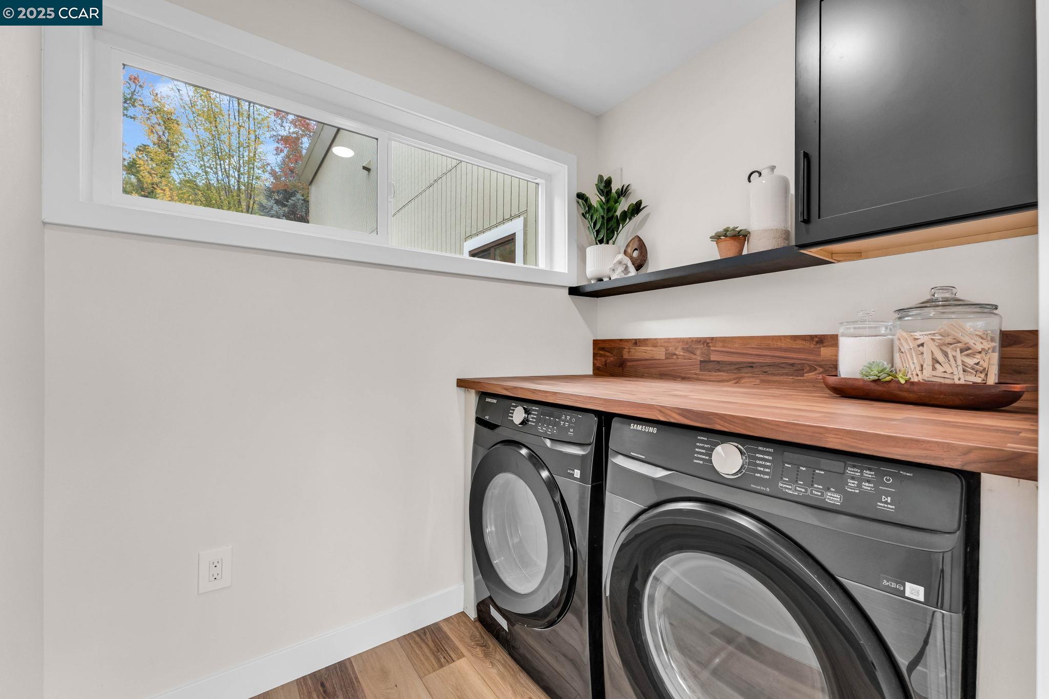 1216 Fairlawn Court, Unit 8 Walnut Creek, CA 94595 - Photo 29 of 49 a view of storage and utility room with washer and dryer