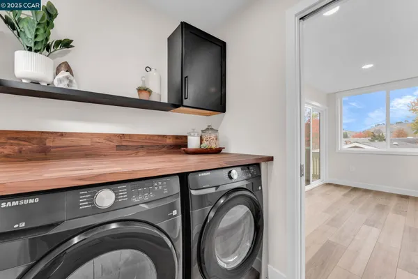 a view of bathroom with washer and dryer