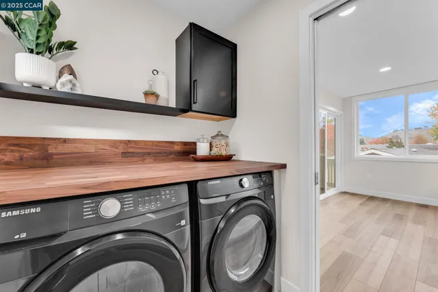 a view of bathroom with washer and dryer