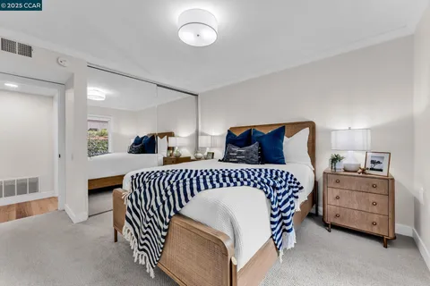 a bedroom with a bed and a cabinets