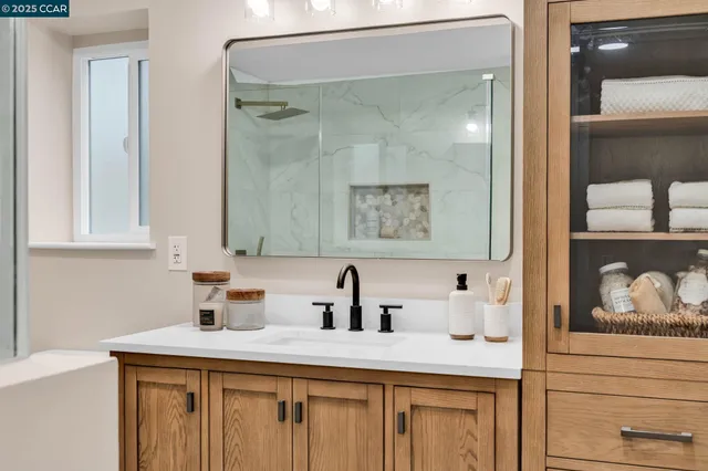 a kitchen with a sink and cabinets