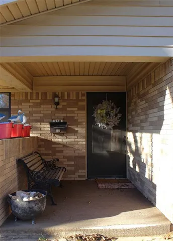 a room with water heater and wooden floor