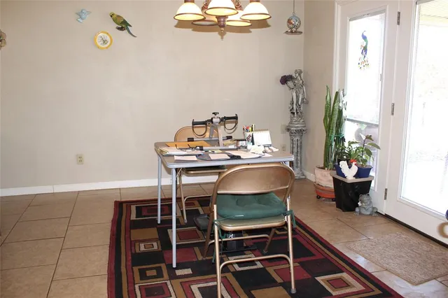 a dining room with furniture and a window