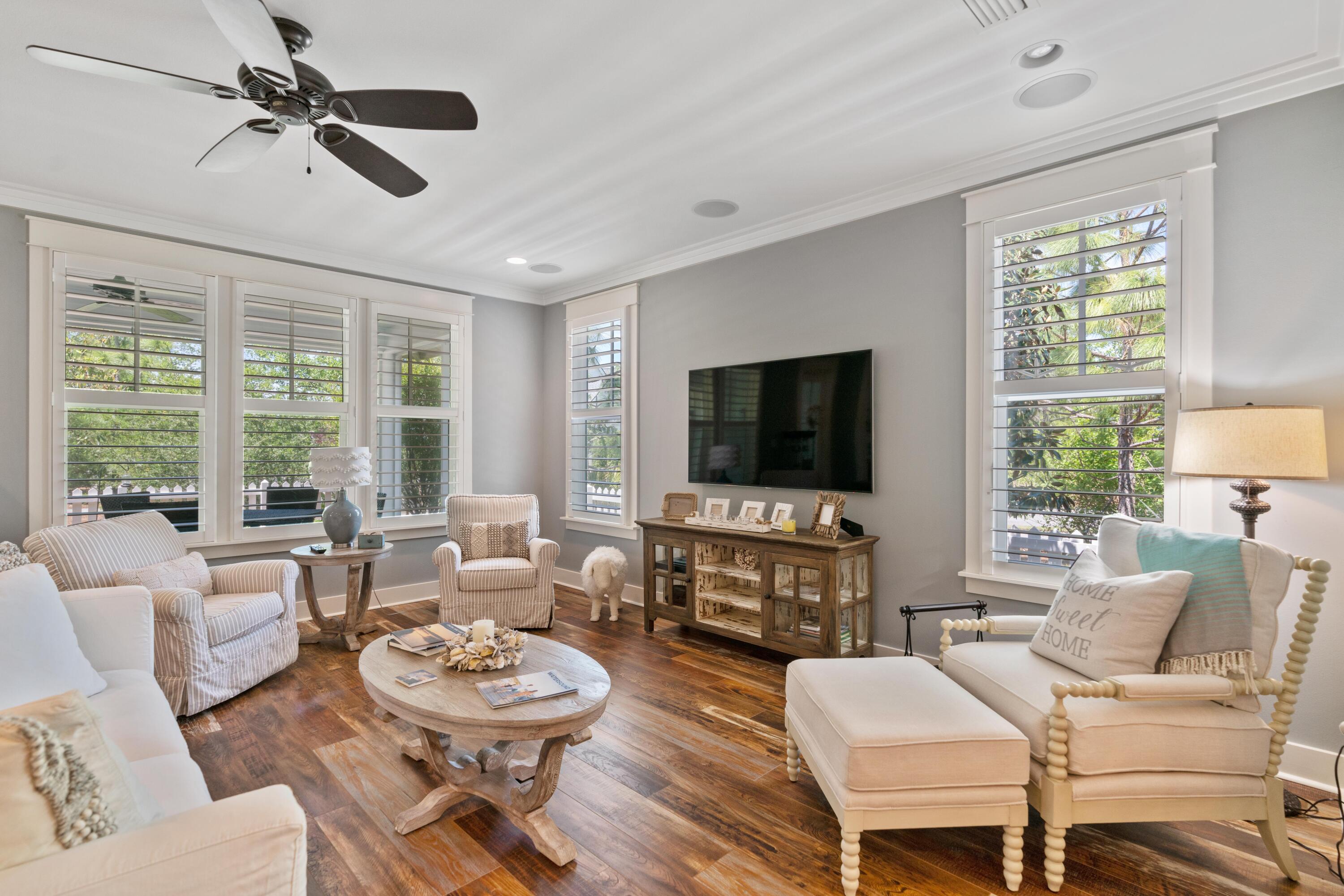 18 Jack Knife Drive Inlet Beach, FL 32461 - Photo 22 of 61 a living room with furniture a large window and a flat screen tv