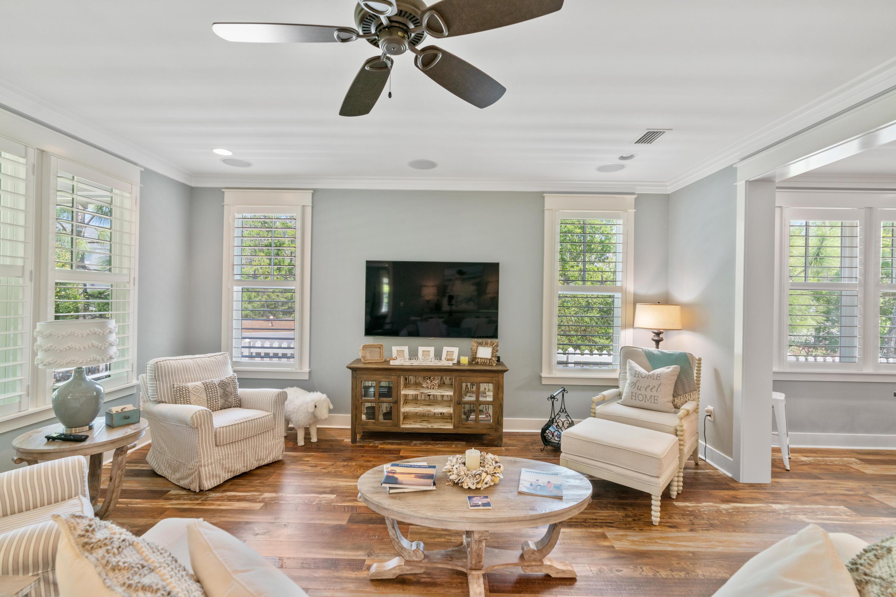 18 Jack Knife Drive Inlet Beach, FL 32461 - Photo 26 of 61 a living room with furniture a flat screen tv and a large window