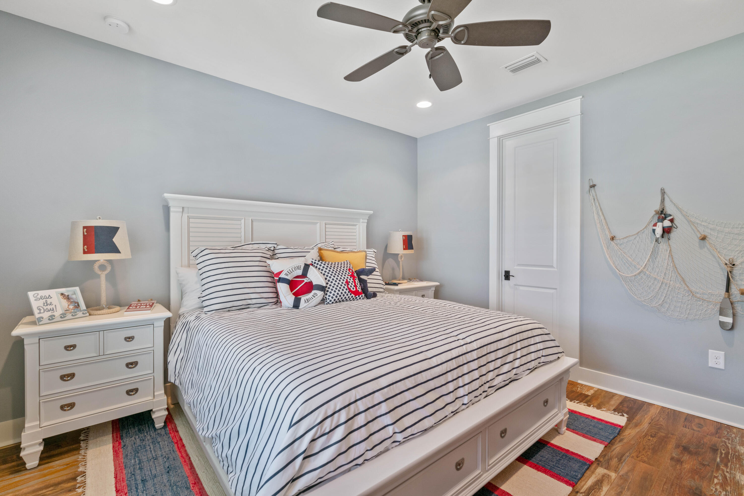 18 Jack Knife Drive Inlet Beach, FL 32461 - Photo 6 of 61 a bedroom with a bed and a chandelier