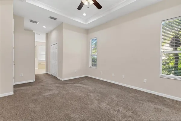 a bathroom with a shower sink vanity mirror and toilet