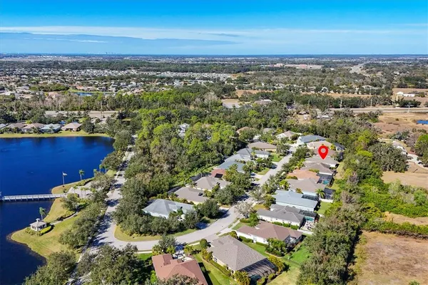 a view of a house with backyard sitting area and garden