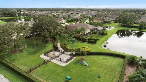a view of a backyard patio and swimming pool