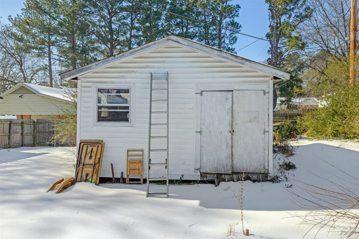 436 Sterling Drive Collierville, TN 38017 - Photo 15 of 40 Snow covered structure with a storage shed
