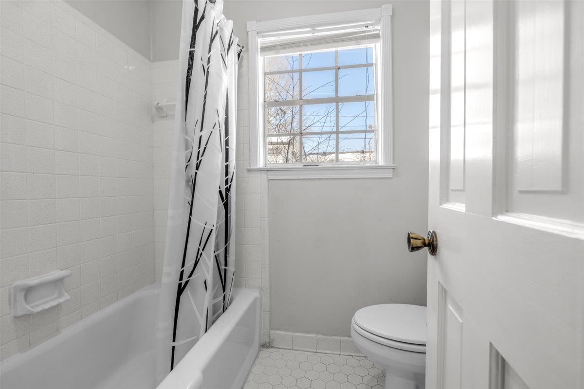 436 Sterling Drive Collierville, TN 38017 - Photo 31 of 40 Bathroom with shower / tub combo and light tile patterned flooring