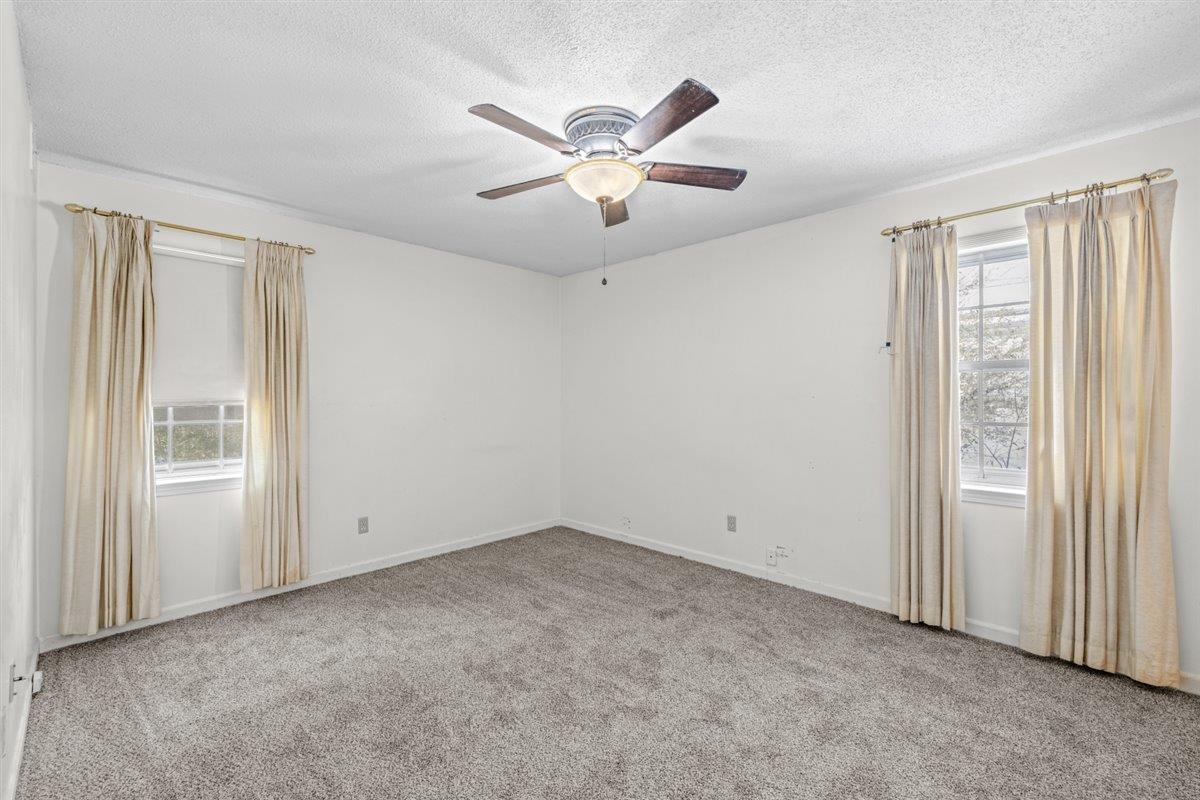 436 Sterling Drive Collierville, TN 38017 - Photo 32 of 40 Unfurnished room with light carpet, a textured ceiling, and a ceiling fan