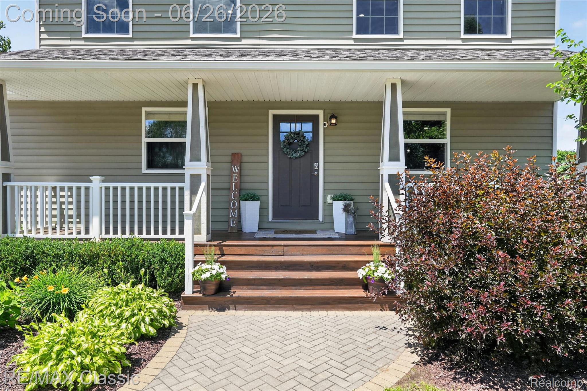 3205 North Milford Road Highland, MI 48357 - Photo 3 of 53 Front facade featuring light green horizontal siding and white trim