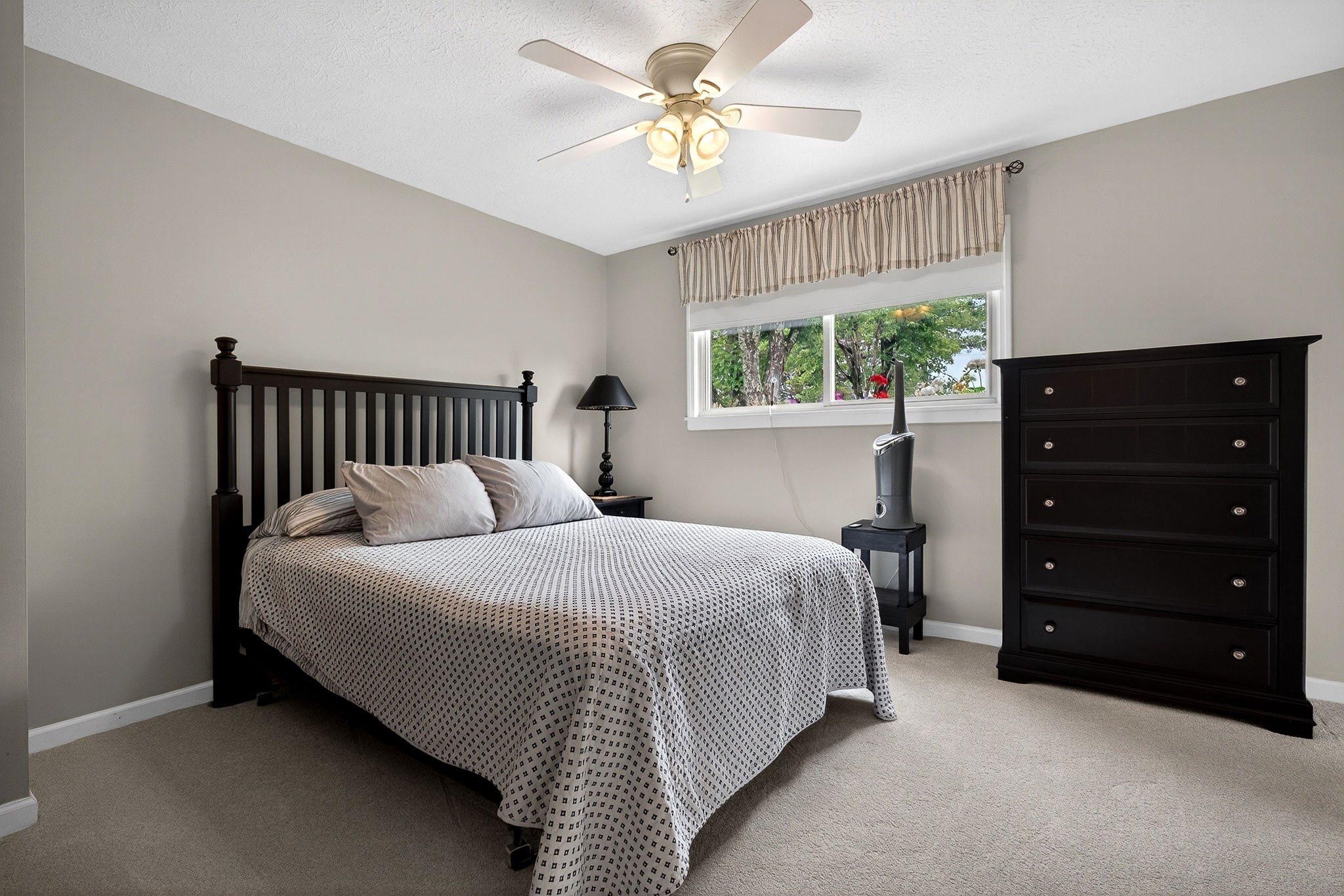 1755 Burgess Falls Road Sparta, TN 38583 - Photo 28 of 56 a bedroom with a bed and a chandelier