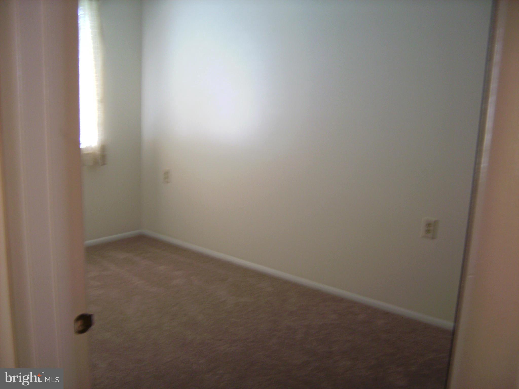 7096 Catalpa Road Frederick, MD 21703 - Photo 14 of 20 a room that has a window in it