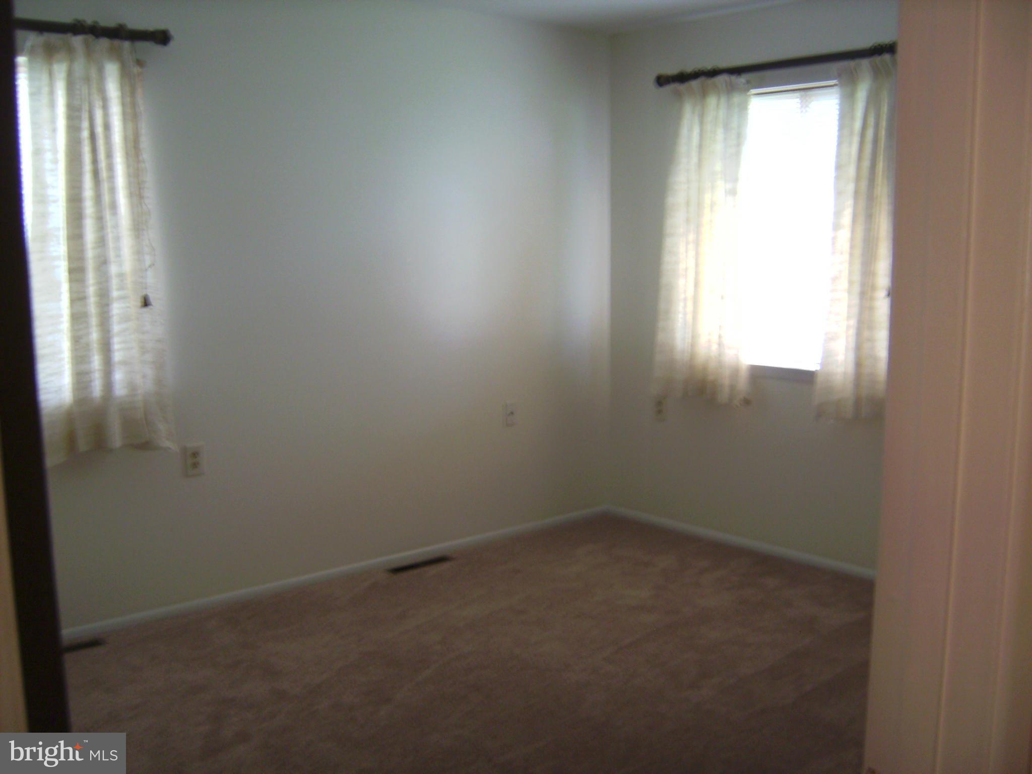 7096 Catalpa Road Frederick, MD 21703 - Photo 16 of 20 an empty room with a window