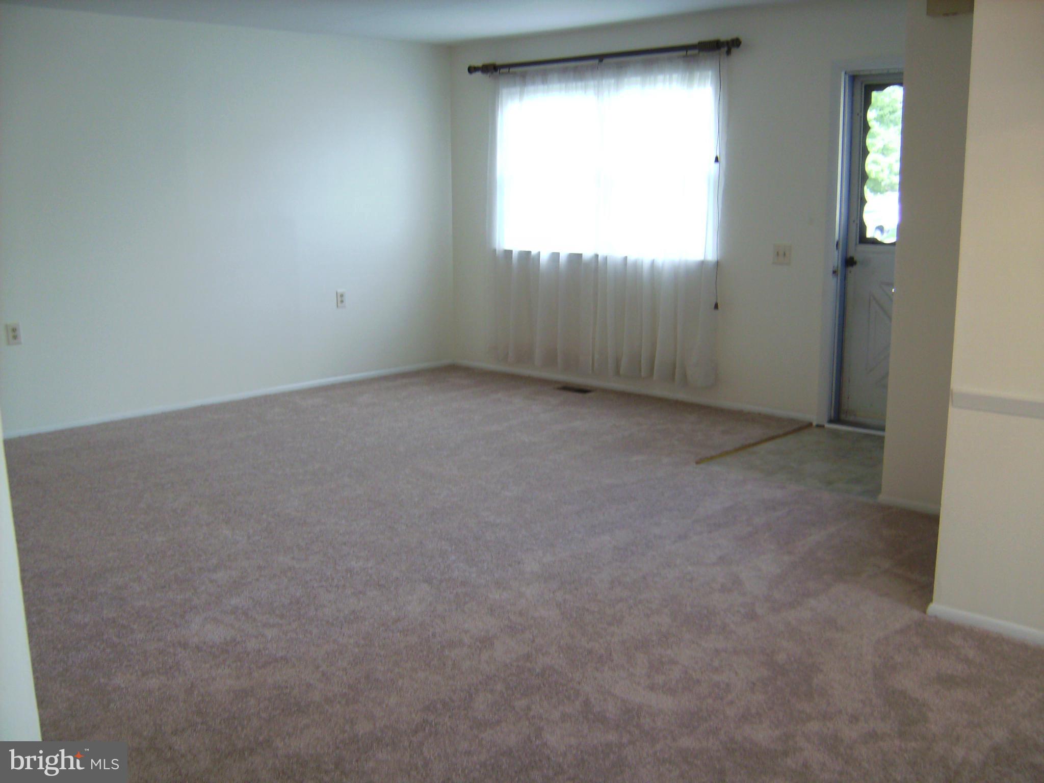 7096 Catalpa Road Frederick, MD 21703 - Photo 4 of 20 an empty room with windows