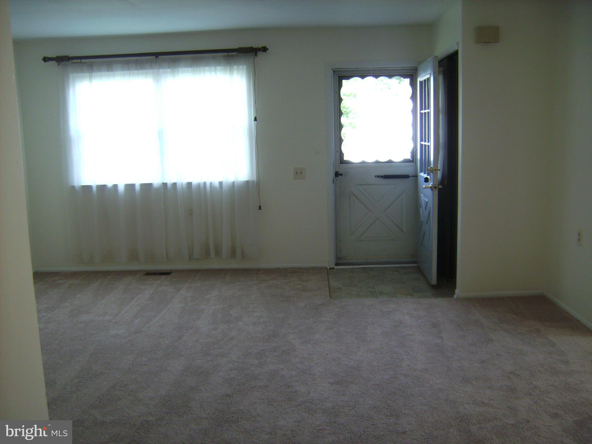 7096 Catalpa Road Frederick, MD 21703 - Photo 5 of 20 an empty room with windows