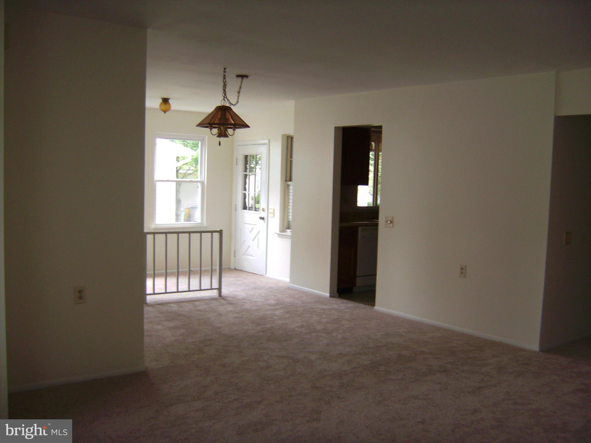 7096 Catalpa Road Frederick, MD 21703 - Photo 6 of 20 a view of empty room with windows